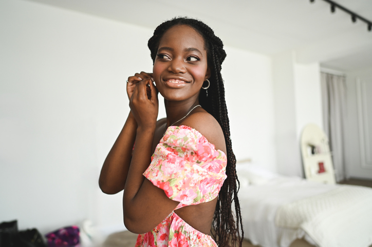 Portrait of a cute cheerful woman getting ready.