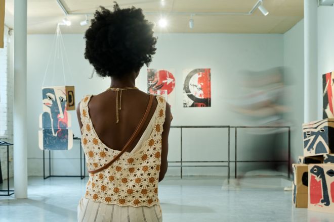Elegant female visitor of vernissage