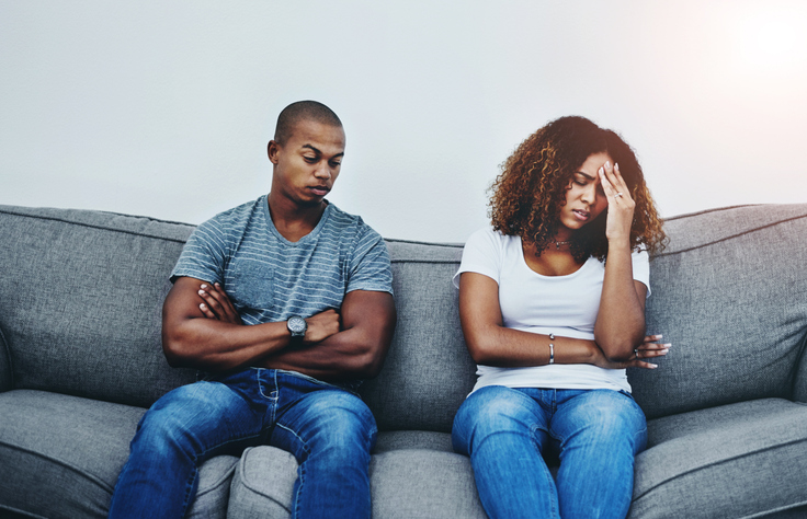 Frustrated couple, sofa and divorce with fight in disagreement, conflict or argument for cheating affair at home. Man or woman in toxic relationship, breakup or ignore in living room dispute at house