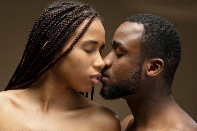 Young Couple Sharing a Tender Kiss with Closed Eyes