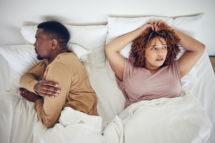 Couple fight, angry and bedroom with a black woman and man feeling frustrated in a bed. Home, conflict and relationship problem from above of a marriage fail and divorce issue in the morning