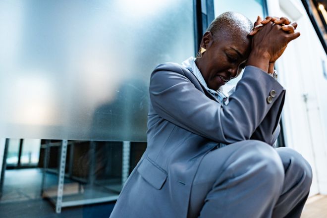 Worried businesswoman at corridor office