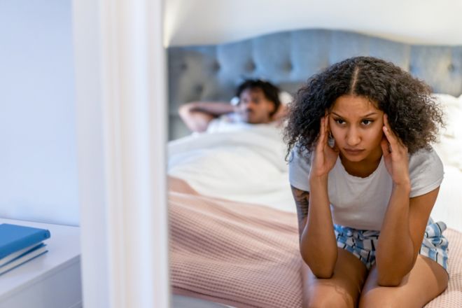 Young couple having marital problems in the bedroom