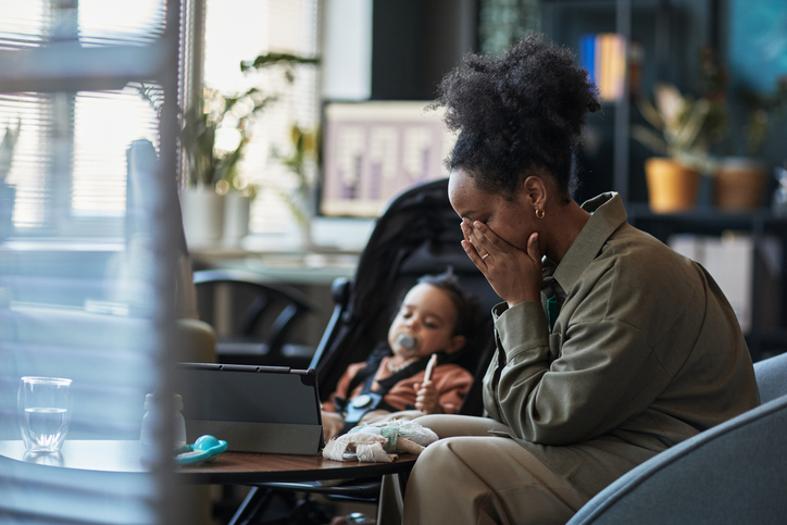 Caring Moment Watching Child Playing in Office Setting