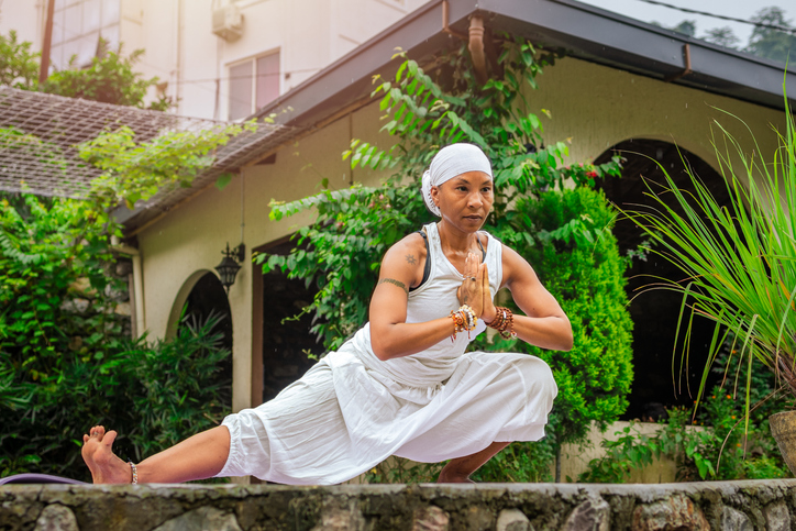 Deep Yoga Stretch with Hands in Prayer Position